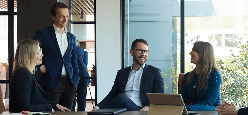 The Moores team in a meeting