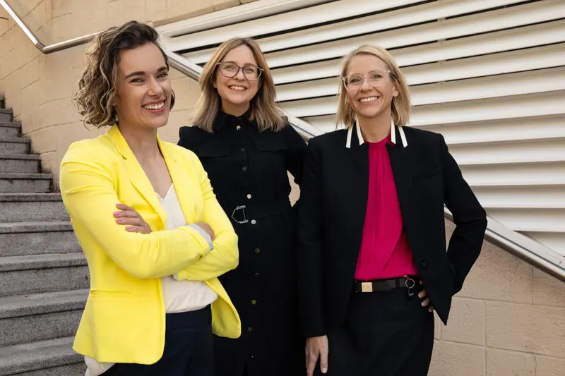 The Parsons Law team standing on steps outside their office