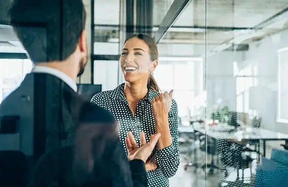 The Robbins Watson Solicitors team talking in an office
